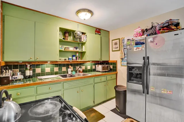 a garden with trees in front of it