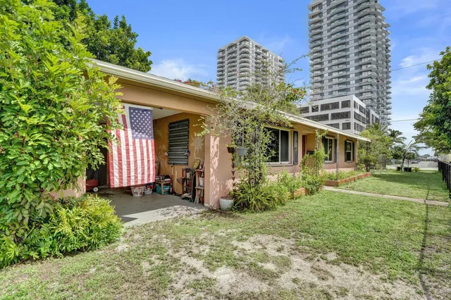 a front view of house with a garden and patio