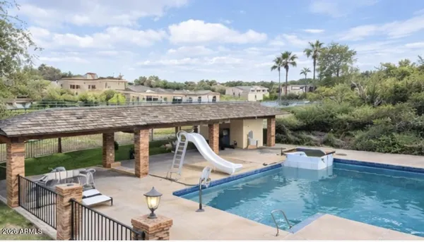 an aerial view of a house with outdoor space