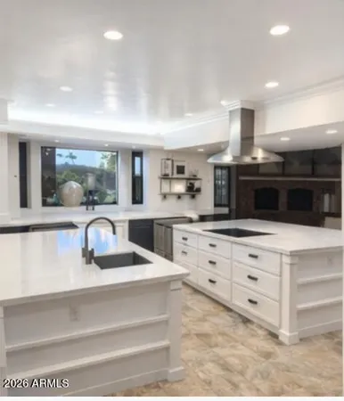 a kitchen with cabinets and window