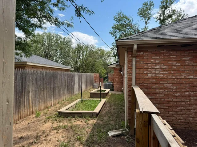 a view of a backyard with chairs