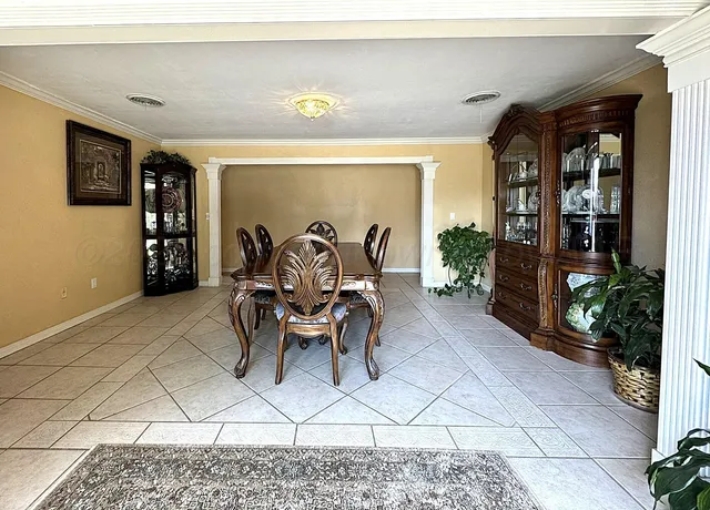 a view of a livingroom with furniture and dining area