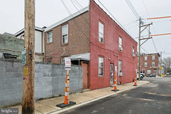 a backyard of a building with parked cars
