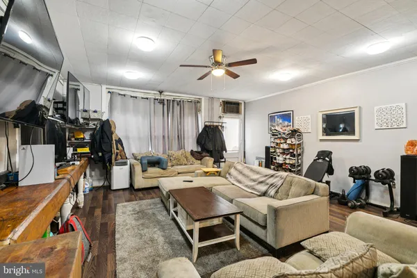 a kitchen with a table chairs refrigerator and cabinets