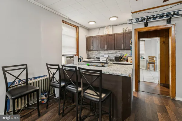 a kitchen with a stove a sink and a refrigerator
