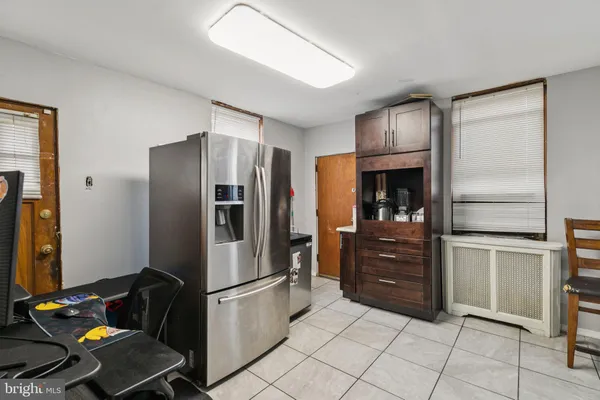 a kitchen with a stove top oven sink and cabinets
