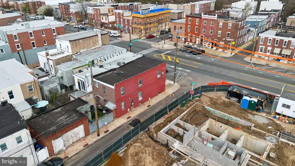 an aerial view of a building with an outdoor space