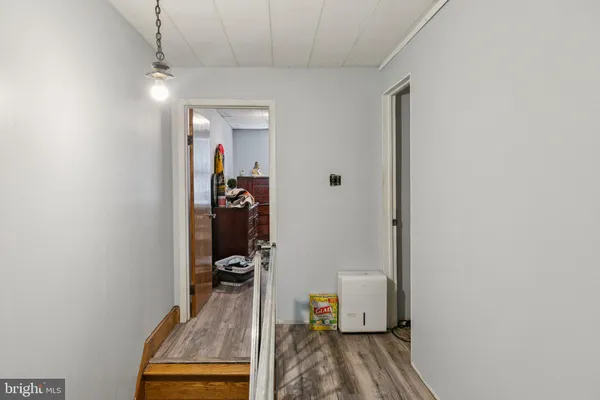 a bedroom with furniture and a flat screen tv