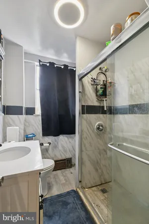 a bathroom with a sink and mirror