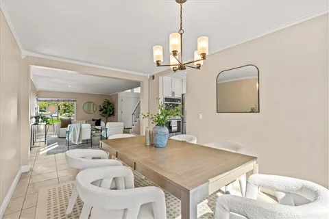 a view of a dining room with a table and chairs