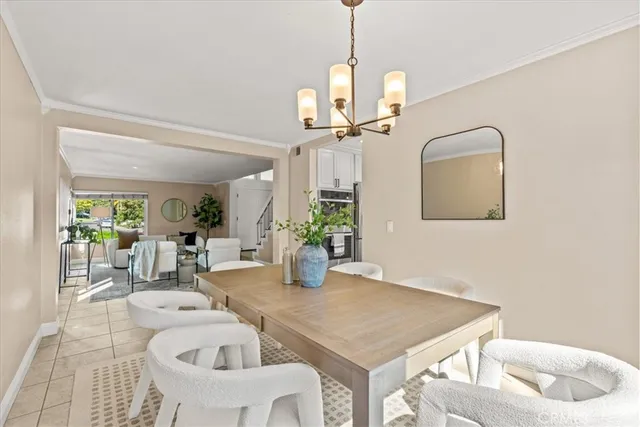 a view of a dining room with a table and chairs