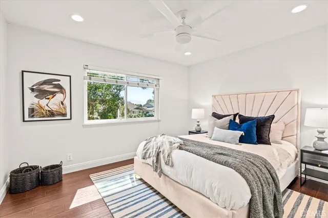 a bedroom with bed and a window