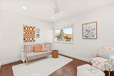 a bedroom with furniture and a window