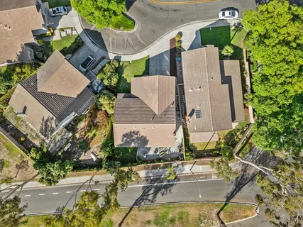an aerial view of a house with a swimming pool
