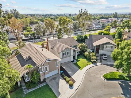an aerial view of a house with a garden