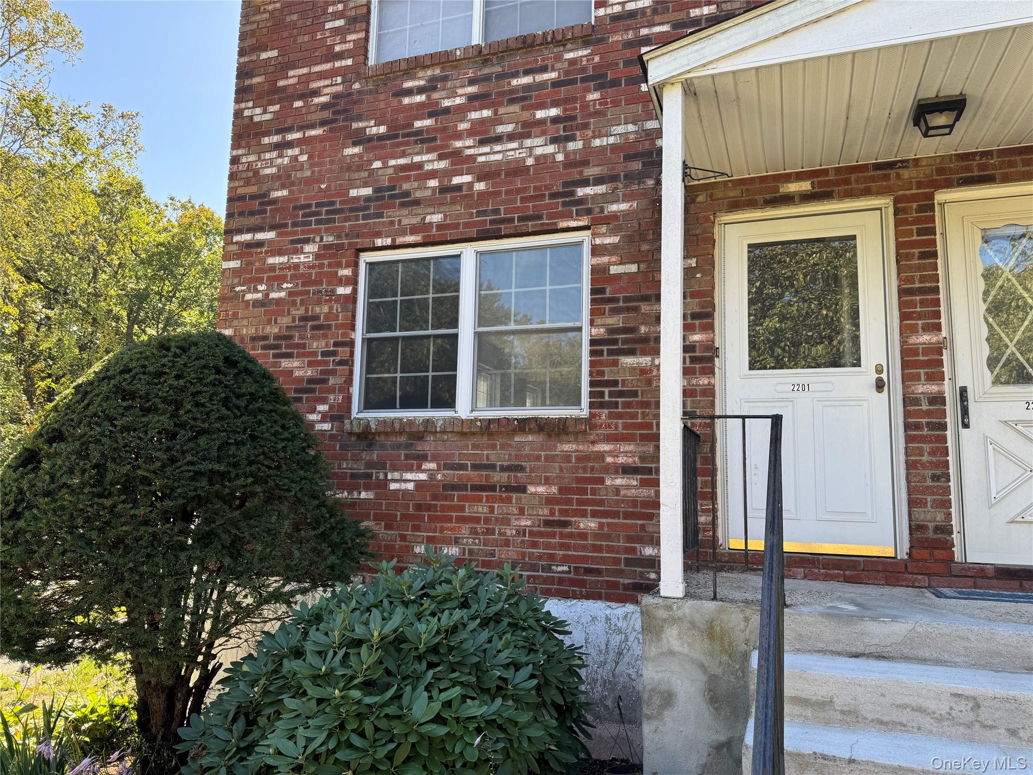 276 Temple Hill Road, Unit 2201 New Windsor, NY 12553 - Photo 1 of 1 front view of a brick house with a large window