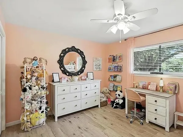 a bed room with a bed and a dresser