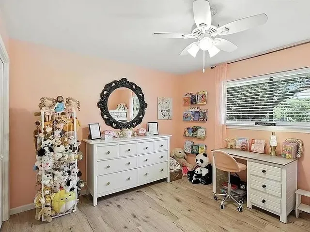 a bed room with a bed and a dresser