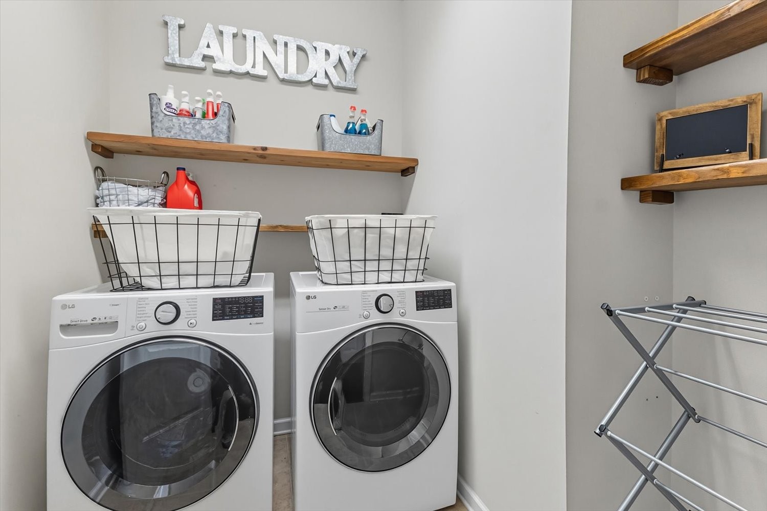 4706 Venito Street Mount Juliet, TN 37122 - Photo 20 of 39 a utility room with dryer washer and a view of living room