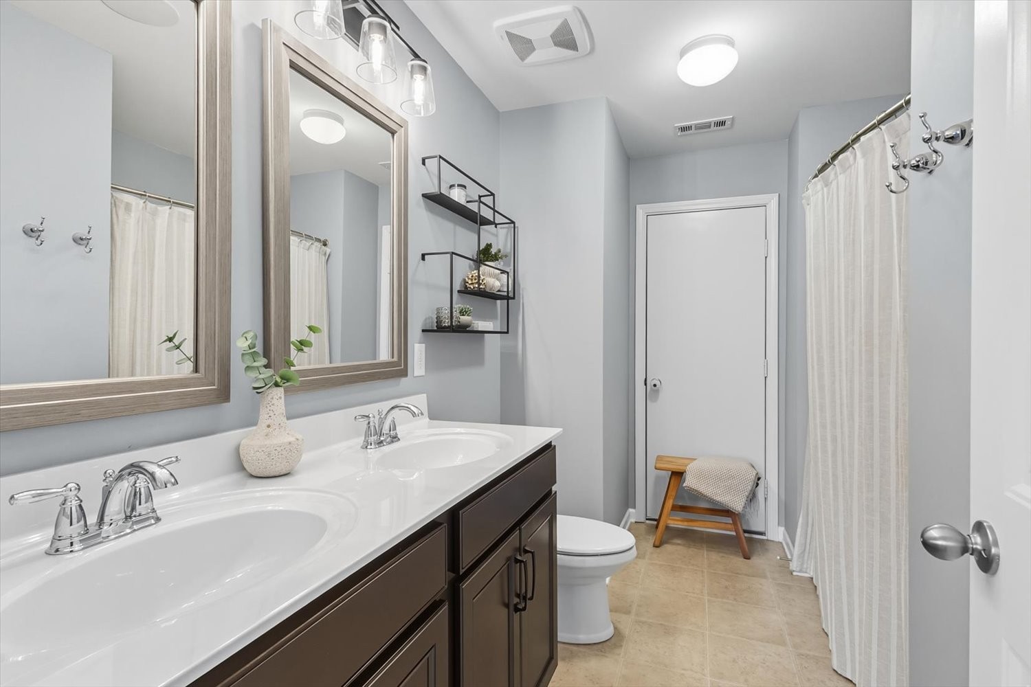 4706 Venito Street Mount Juliet, TN 37122 - Photo 27 of 39 a bathroom with a sink double vanity and a mirror