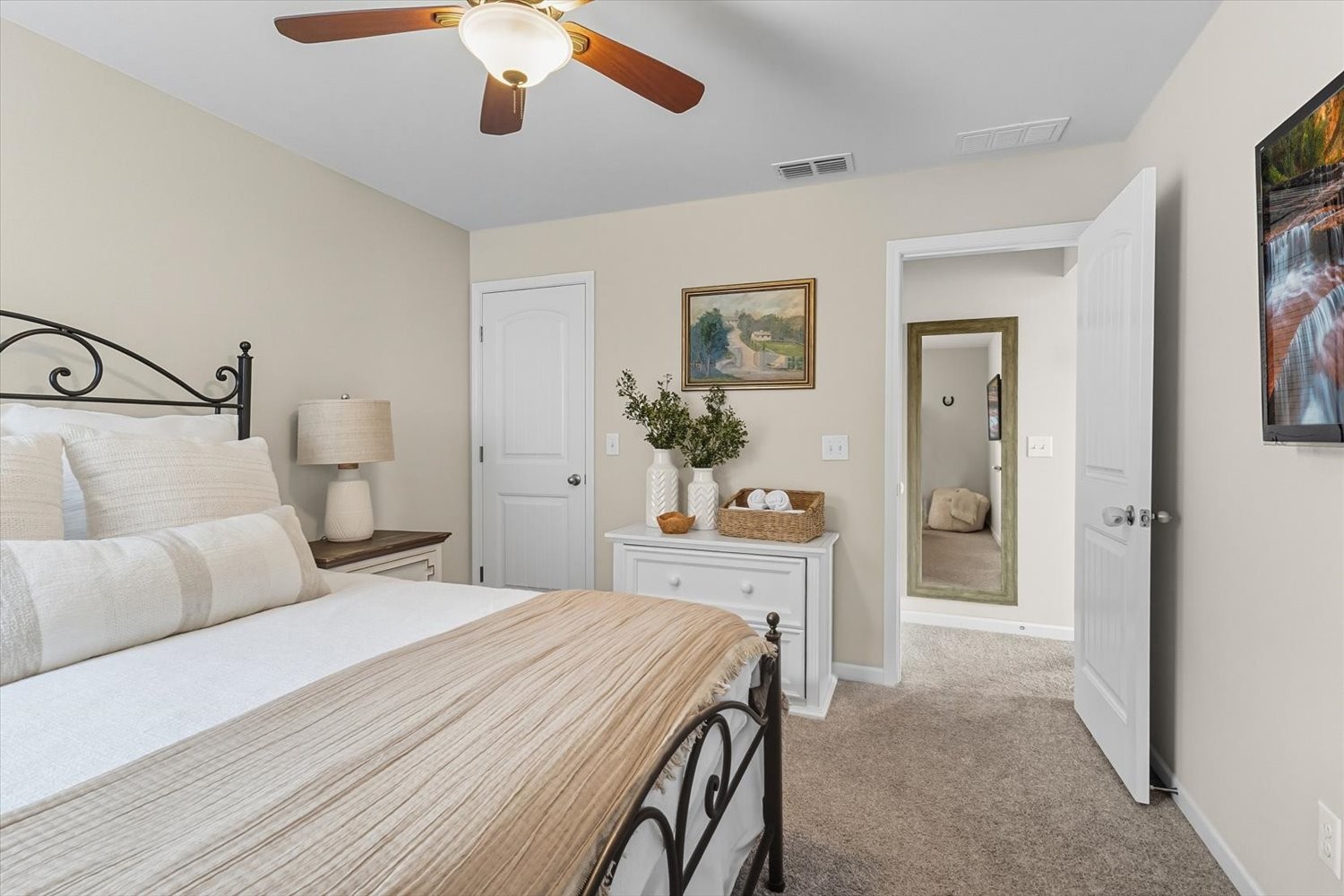 4706 Venito Street Mount Juliet, TN 37122 - Photo 31 of 39 a bedroom with a large bed and ceiling fan