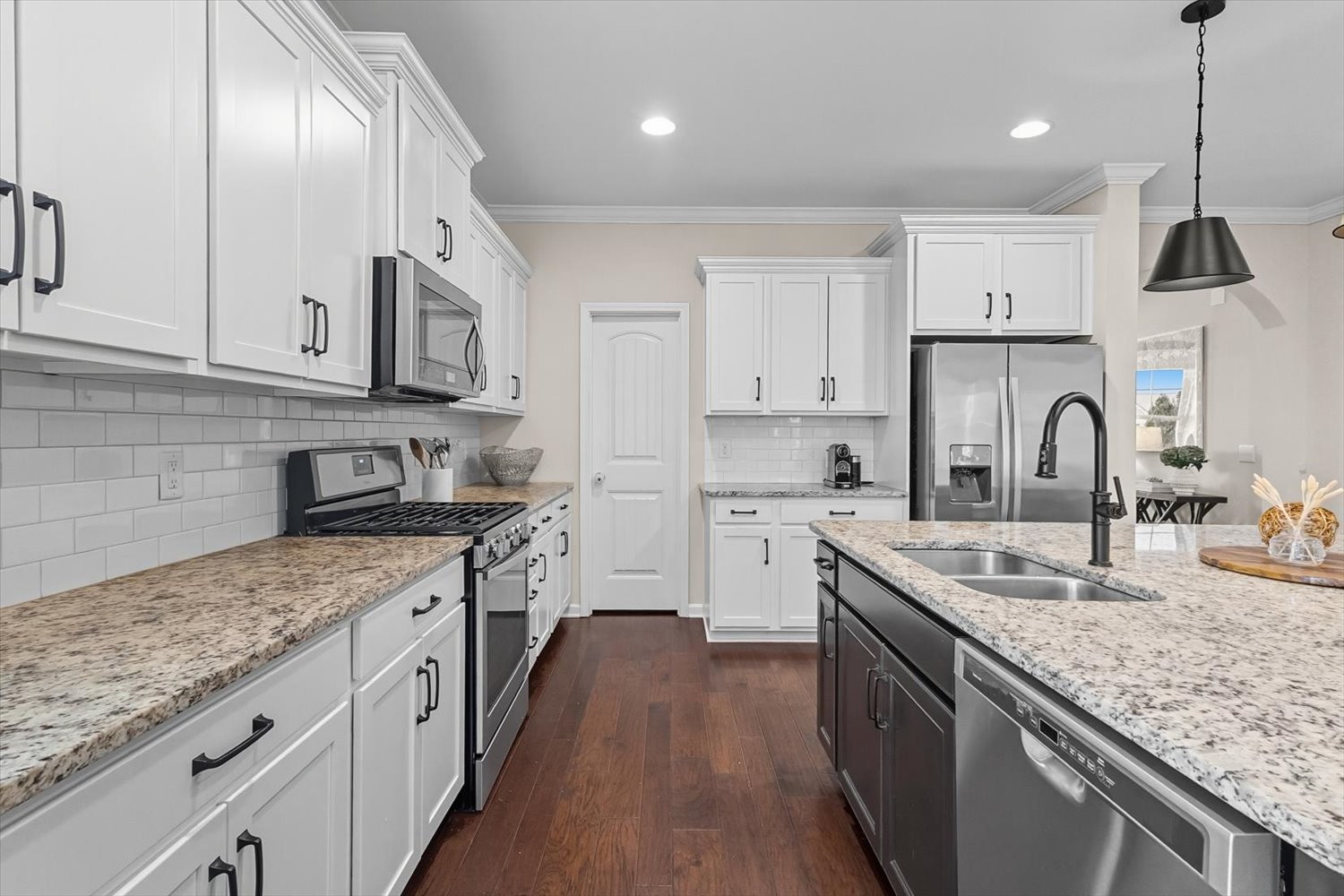 4706 Venito Street Mount Juliet, TN 37122 - Photo 7 of 39 a kitchen with stainless steel appliances granite countertop a sink stove and refrigerator