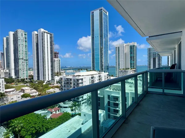 a view of a balcony and chairs