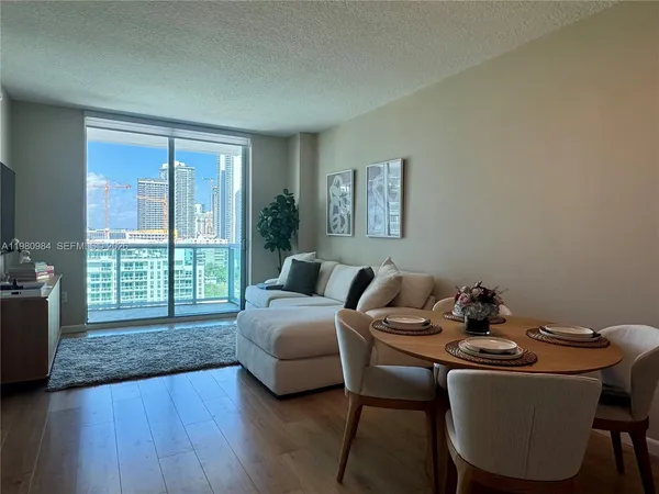 a living room with furniture and a yard