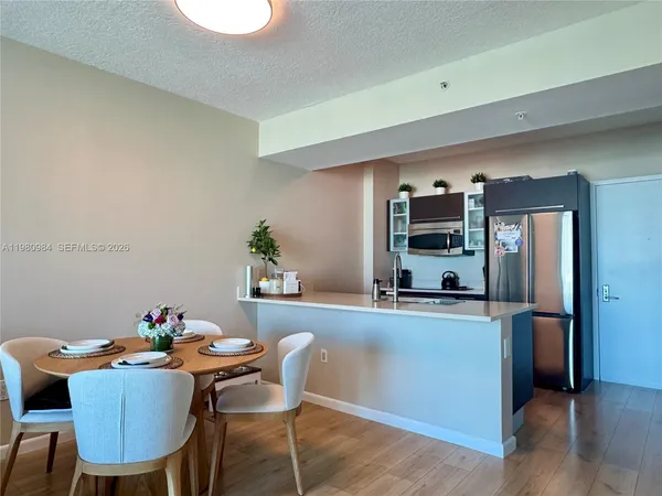 a dining room with furniture and window
