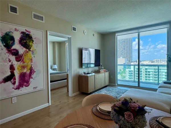 a living room with furniture and a large window