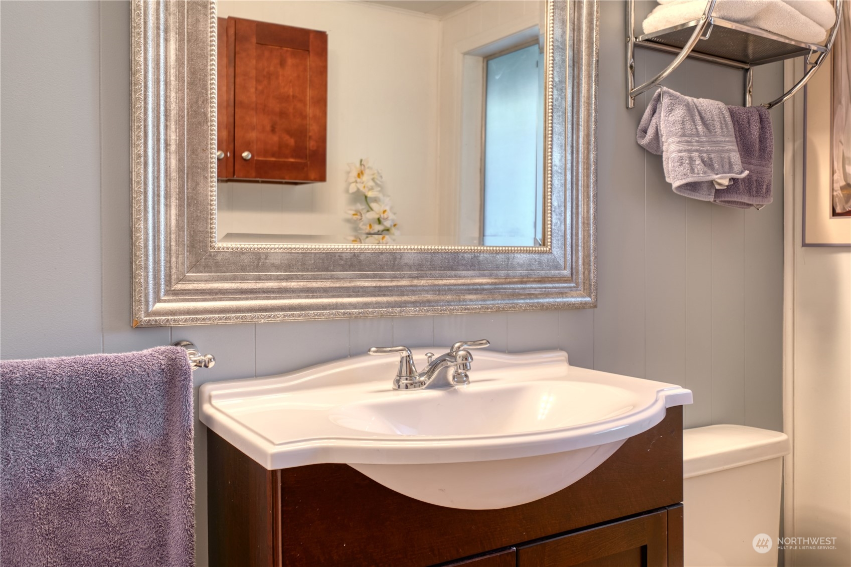 1788 Cliff Road Point Roberts, WA 98281 - Photo 27 of 39 a bathroom with a sink and a mirror