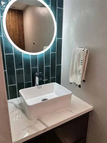 a white toilet sitting next to a small bathroom