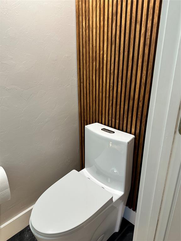 620 Northeast 28th Street, Unit 207 Wilton Manors, FL 33334 - Photo 14 of 30 a white toilet sitting next to a small bathroom