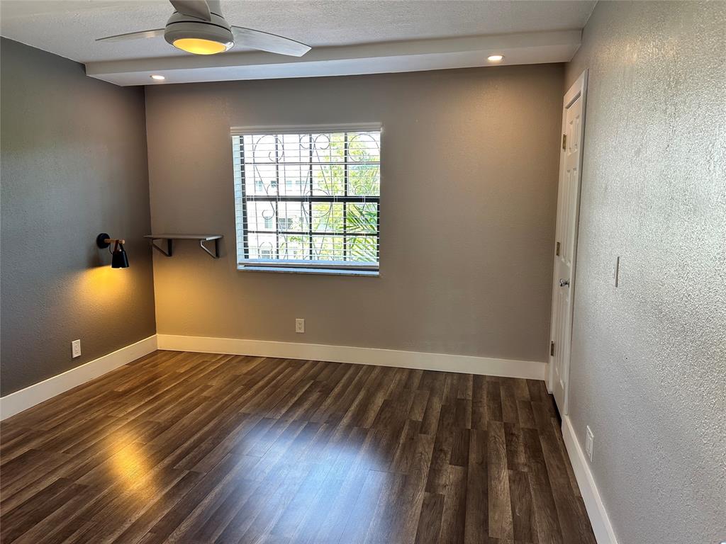 620 Northeast 28th Street, Unit 207 Wilton Manors, FL 33334 - Photo 15 of 30 wooden floor in an empty room with a window