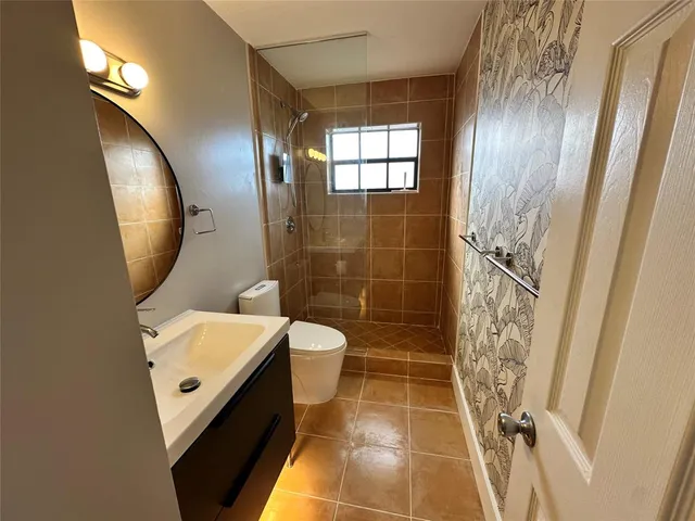 a close up of a sink and a mirror