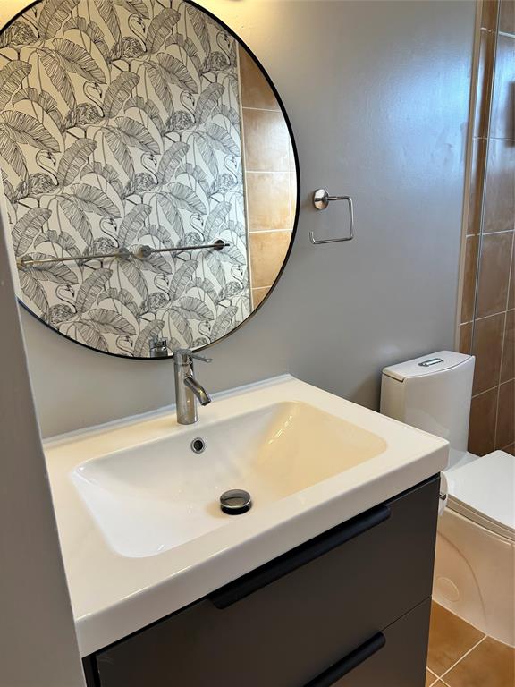 620 Northeast 28th Street, Unit 207 Wilton Manors, FL 33334 - Photo 21 of 30 a close up of a sink and a mirror