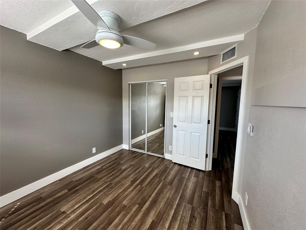 620 Northeast 28th Street, Unit 207 Wilton Manors, FL 33334 - Photo 24 of 30 wooden floor in an empty room
