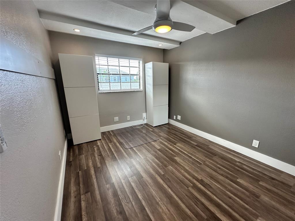 620 Northeast 28th Street, Unit 207 Wilton Manors, FL 33334 - Photo 25 of 30 wooden floor in an empty room with a window