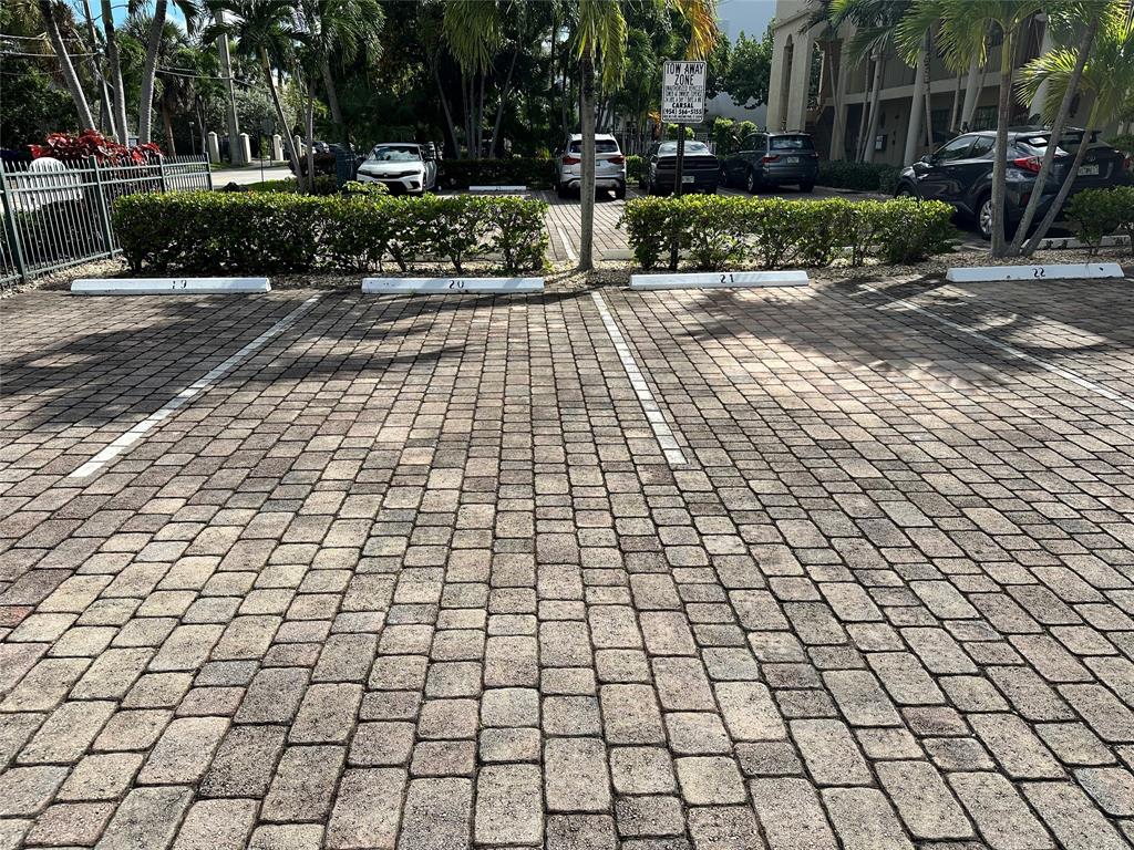 620 Northeast 28th Street, Unit 207 Wilton Manors, FL 33334 - Photo 28 of 30 a view of a pathway with a yard