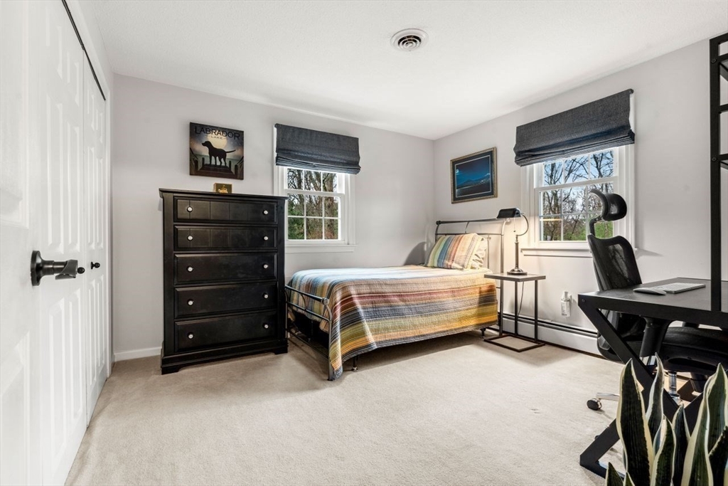 6 Ridge Hill Way Andover, MA 01810 - Photo 19 of 42 a bedroom with a bed and a cabinets