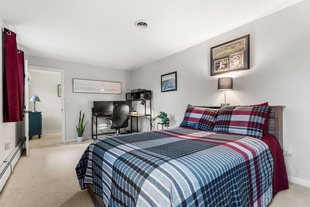 6 Ridge Hill Way Andover, MA 01810 - Photo 24 of 42 a bed room with a bed and a chair