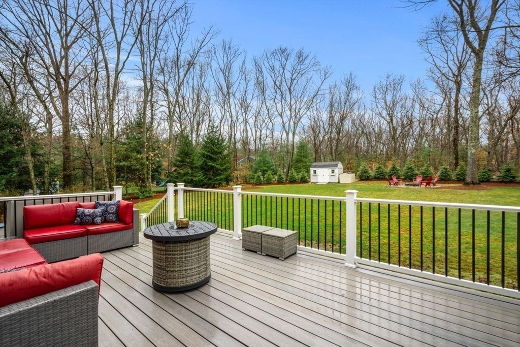 6 Ridge Hill Way Andover, MA 01810 - Photo 30 of 42 a view of a deck with couches and wooden floor