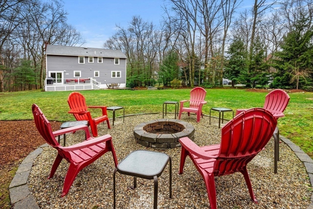 6 Ridge Hill Way Andover, MA 01810 - Photo 33 of 42 a view of a table and chairs in backyard