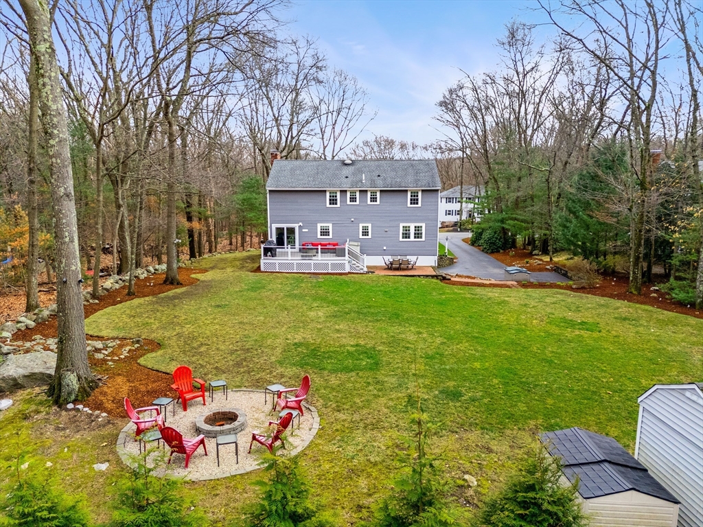 6 Ridge Hill Way Andover, MA 01810 - Photo 34 of 42 a backyard of a house with table and chairs