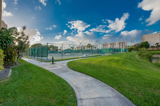 a view of building with outdoor space and lake view