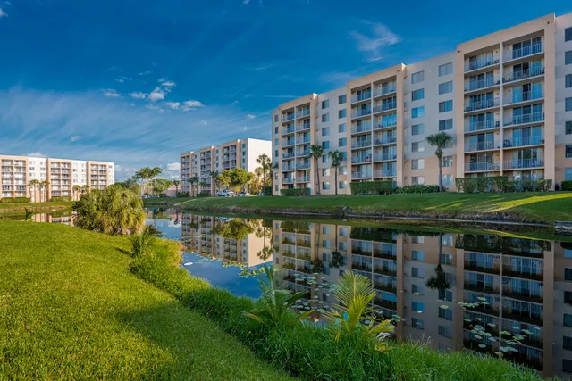 a view of a lake with a building in the background