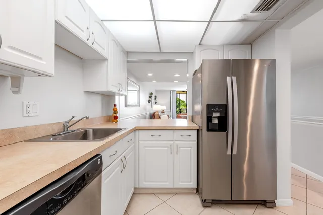 a kitchen with a sink and refrigerator