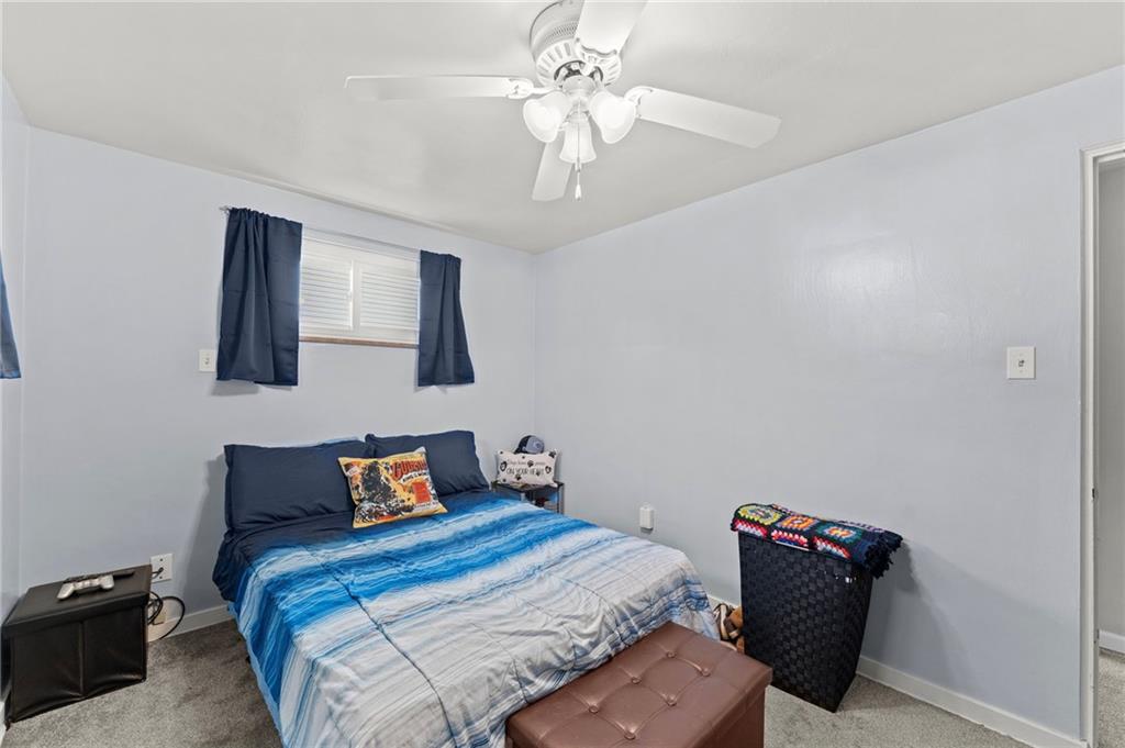 800 Burchfield Road Allison Park, PA 15101 - Photo 13 of 30 a bedroom with a bed and a chandelier