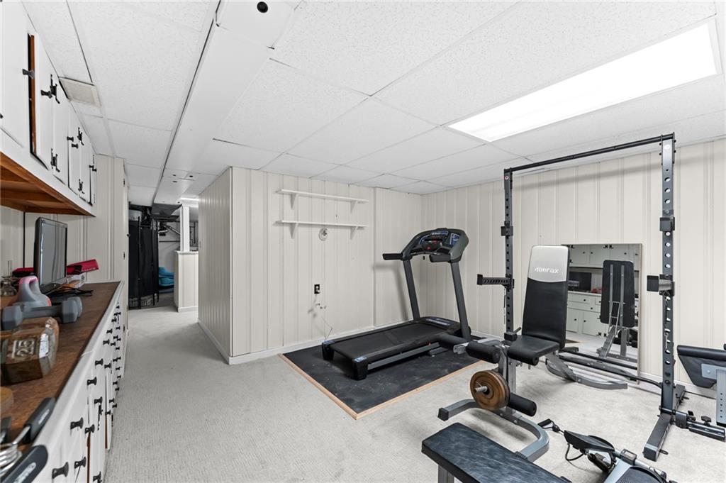 800 Burchfield Road Allison Park, PA 15101 - Photo 22 of 30 a room with gym equipment and a mirror