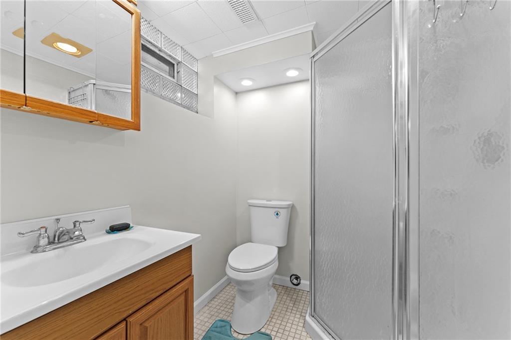 800 Burchfield Road Allison Park, PA 15101 - Photo 24 of 30 a bathroom with a sink a toilet and a mirror